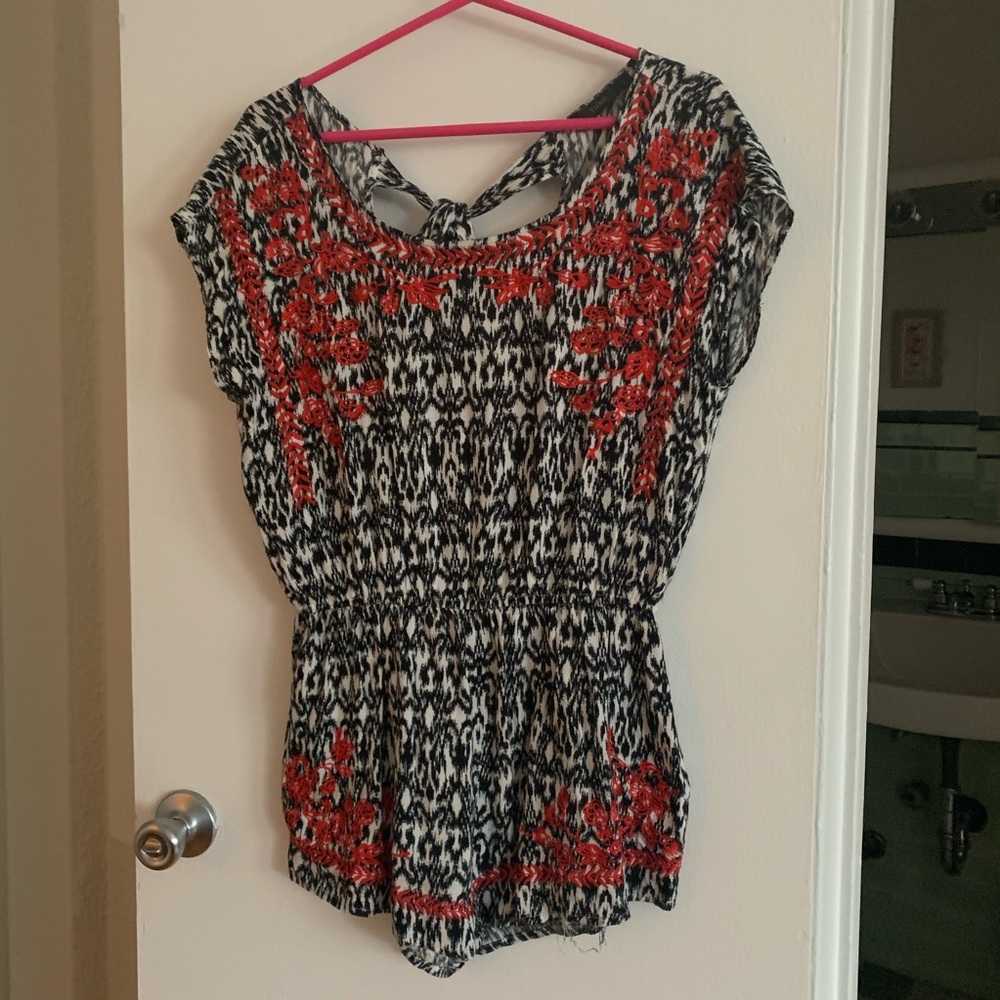 Black and white romper with red embroider detail